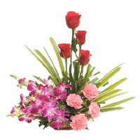 Send Online Diwali Flowers to Bengaluru containing Orchids, Roses, Carnation Basket of 12 Flowers to Bangalore