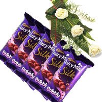 Order New Year Gifts in Bangalore comprising of 5 Cadbury Silk Bubbly Chocolate With 3 White Roses in Bangalore