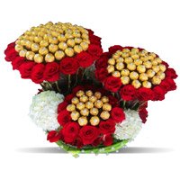 Send Online New Year Gifts to Bengaluru including 96 Pcs Ferrero Rocher 200 Red White Roses Bouquet