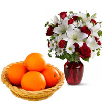 Send Online 2 White Lily 6 White Gerbera 6 Red Roses Vase with 12 pcs Fresh Orange Basket in Gifts to Bangalore