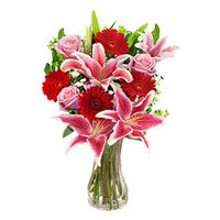 Cheapest New Year Flower Delivery in Bangalore. 4 Pink Lily 4 Pink Rose 4 Red Gerbera Vase