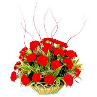 Send New Year Flowers to Bangalore containing 6 Yellow Lily 6 Red Carnation Arrangement of Flowers to Bangalore