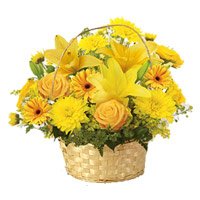 Deliver Diwali Flowers to Bangalore comprising of Yellow Lily, Gerbera, Rose, Carnation Basket 12 Flowers in Bengaluru Online