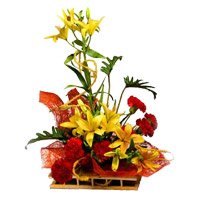 New Year Flowers Delivery to Bangalore containing 6 Yellow Lily 6 Red Carnation Arrangement of Flowers in Bengaluru