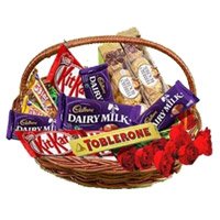 Deliver Basket of Assorted Chocolate to Bangalore and 10 Red Roses. New Year Gifts Delivery in Bengaluru