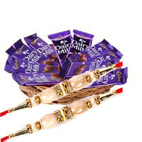 Send Rakhi with 12 Dairy Milk Chocolate Basket With 1 Red Rose Flowers and Rakhi Gifts to Bangalore