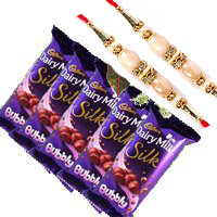 Deliver Rakhi Gifts in Bangalore that includes 5 Cadbury Silk Bubbly Chocolate With 3 White Roses