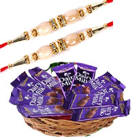 Send Gifts to Bangalore Online that includes Dairy Milk Basket 12 Chocolates With 12 Pink Roses on Rakhi